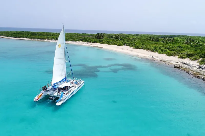 Catamaran sailing past Icacos Island on a full-day boat tour from Fajardo, Puerto Rico