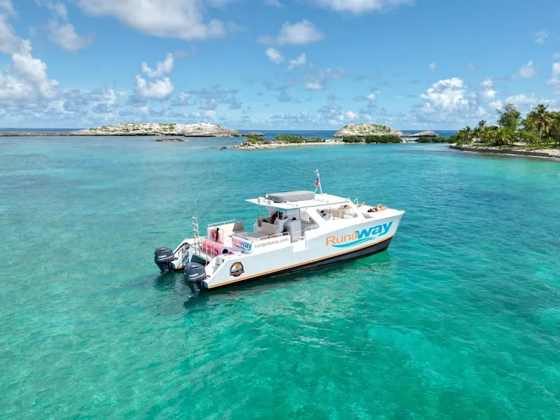 Snorkelers in the crystal-clear Cordillera Nature Reserve reef on a power catamaran boat tour to Icacos Island from Fajardo
